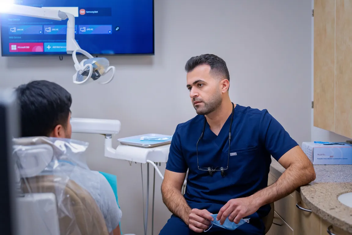 A dentist discussing treatment options with a patient in Mount Prospect, IL